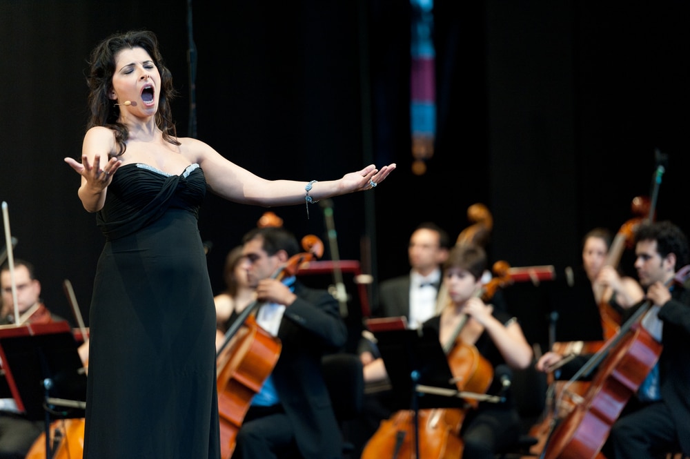 A stunning opera singer performing at venues like the Santa Fe Opera