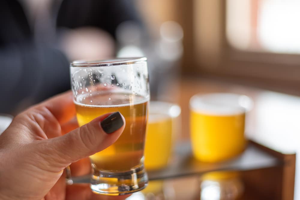 Woman Drinking A Beer At One Of The Best Breweries In Santa Fe