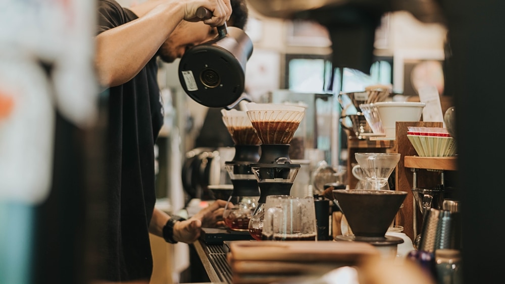 A Barista at a local coffee shop, where you'll find the best coffee in Santa Fe