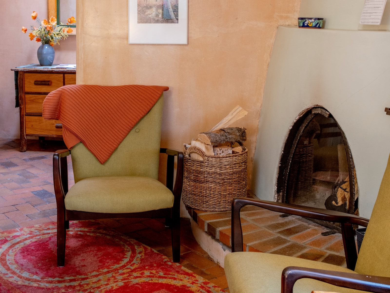 A Chair Beside A Fireplace At A Bed And Breakfast In Santa Fe.
